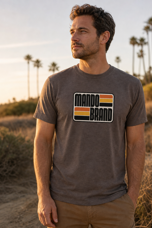 SoCal Mando tee in Macchiato, worn at golden hour among Southern California palms